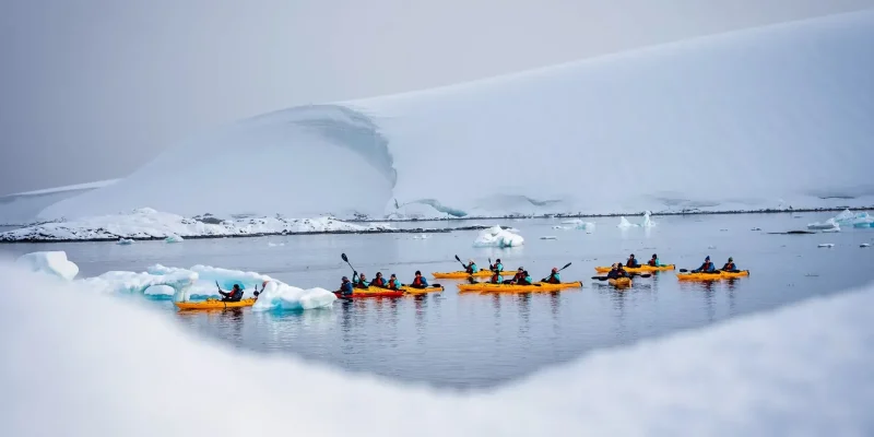 ANTARCTICA_CRUISES_best_time_to_visit_Antarctica__Sea-Kayaking-Port-Lockroy-Antarctica-Tyson-Mayr ANTARCTICA_CRUISES_SLIDER_IMAGE_Sea-Kayaking-Port-Lockroy-Antarctica-Tyson-Mayr